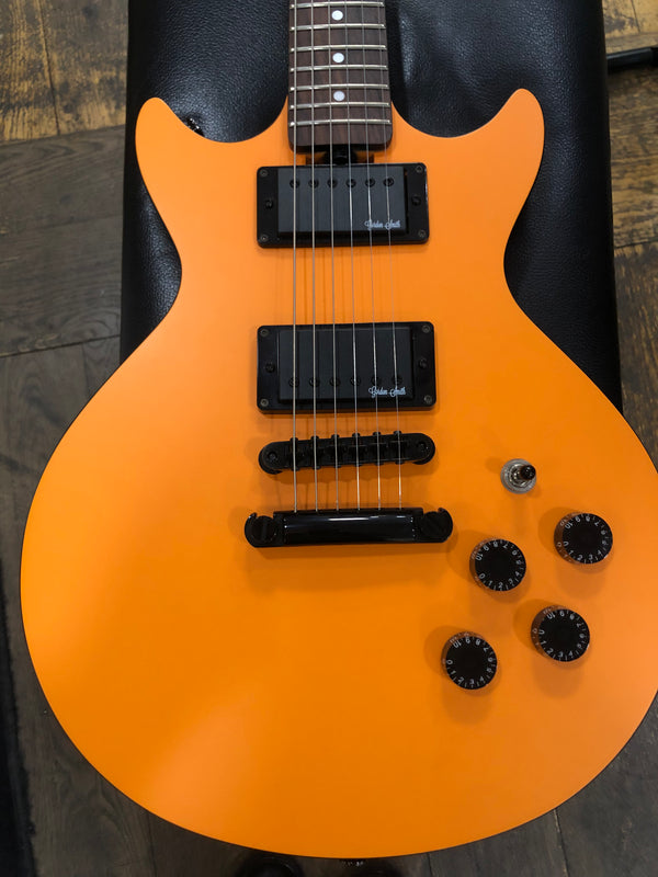 Used Gordon Smith Double cutaway electric. Orange.